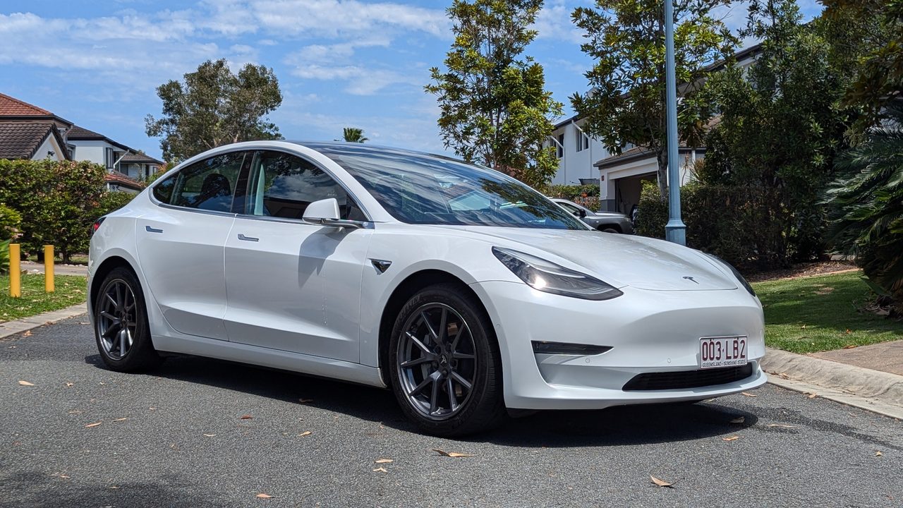 Rocket Man, a Tesla Model 3 from the Rent Ridez fleet, on a Gold Coast street